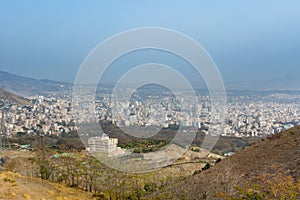 City view of Tehran City with dust and mist and modern buildings, Iran form Tohal mountain. Tochal is a popular recreational