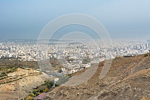 City view of Tehran City with dust and mist and modern buildings, Iran form Tohal mountain. Tochal is a popular recreational