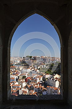 City viewed through castle`s window in Lisbon