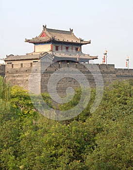 City Wall, Xian, Shaanxi Province, China. Watchtower on Xian city wall overlooking trees.