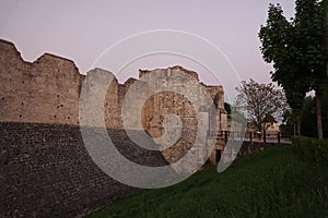 City walls of medieval Provins at sunset in France