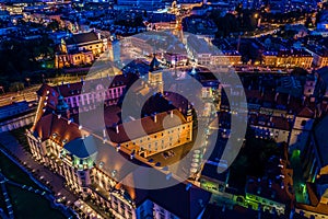 City of Warsaw by night in Poland, Castle Square in the Old Town, picturesque urban landscape of the capital city. Travel