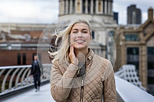 City woman in front of St. Pauls Cathedral in London, UK