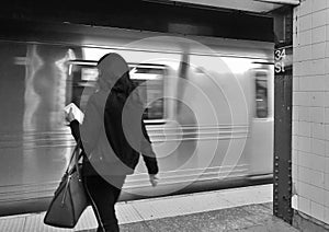 City Woman Taking Busy Subway Train MTA New York photo