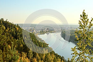 The city Zelenogorsk and taiga in the rays of the setting sun