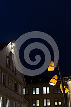 citylights at night with facades and architecture of a marketplace