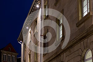 citylights at night with facades and architecture of a marketplace