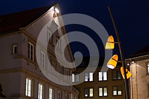 citylights at night with facades and architecture of a marketplace