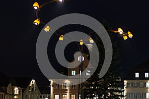 citylights at night with facades and architecture of a marketplace