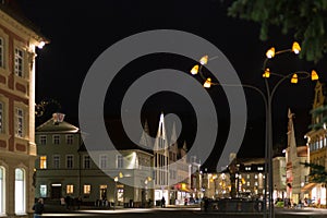 citylights at night with facades and architecture of a marketplace