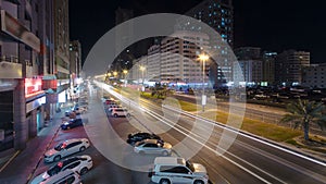 Cityscape of Ajman from rooftop night aerial timelapse