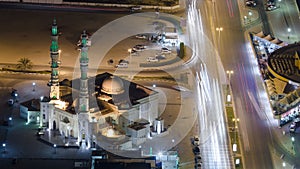 Cityscape of Ajman from rooftop night aerial timelapse