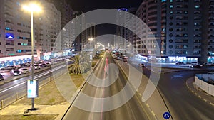 Cityscape of Ajman from rooftop night aerial timelapse