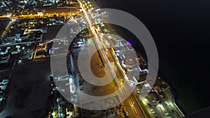 Cityscape of Ajman from rooftop night aerial timelapse photo