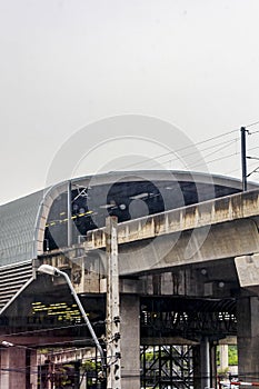 Cityscape architecture and rain at Makkasan station in Bangkok Thailand