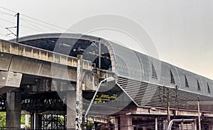 Cityscape architecture and rain at Makkasan station in Bangkok Thailand