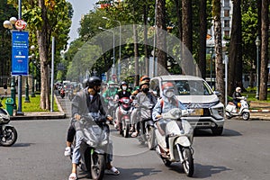 Cityscape of the asian metropolis Saigon. Scooters and motorcycles characterise road traffic