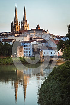 Cityscape Bayonne, France with cathedral reflected in river Nive