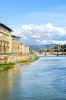 Cityscape of beautiful Florence, Tuscany, Italy photographed from the famous Ponte Vecchio Bridge. Historical buildings including