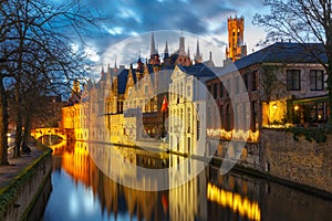 Cityscape with Belfort and Green canal in Bruges photo