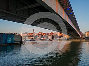 Cityscape of Belgrade under the Branko`s bridge at twilight