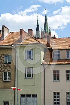 Cityscape of Bialystok, view of townhouses, red rooftops and towers of neo-Gothic Cathedral Basilica.