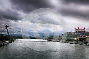 Cityscape of Bratislava city with the SNP bridge UFO bridge over Danube river and old castle,. Bratislava, Slovakia