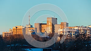 Cityscape with building exteriors in the rays of the setting Sun. Kharkiv city center