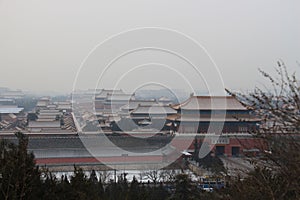 Cityscape of China, Beijing, Forbidden City on a foggy winter day