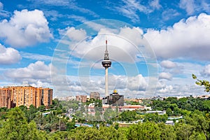 Cityscape of the city of Madrid with its communications tower called Piruli on a day of clouds and sun. photo