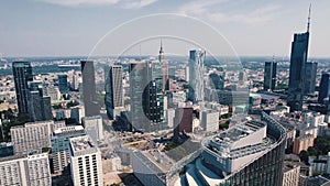 Cityscape of contemporary apartment buildings and skyscrapers with Palace of Culture and Science. Drone shot with