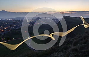 Cityscape at Dusk with Light Trail