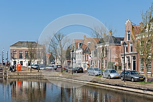 Cityscape Dutch village Makkum with historic houses along a canal