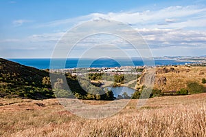 Cityscape of Edinburgh from Arthur& x27;s Seat in a beautiful summer day, Scotland, United Kingdom, summer day