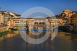 Cityscape with the famous Ponte Vecchio bridge in Centro Storico, Florence Italy photo