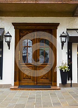 Cityscape of Façade and door with flowers, in Cortina dAmpezzo, Province of Belluno, Italy