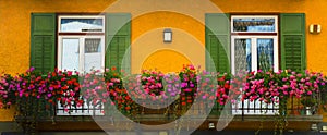 Cityscape of Façade and flowers on balcony, in Cortina dAmpezzo, Province of Belluno, Italy