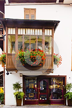 Cityscape of Façade and flowers on balcony, in Cortina dAmpezzo, Province of Belluno, Italy