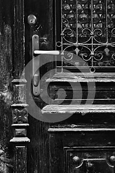 Cityscape of Façade of wood door details with glass and iron, in Cortina dAmpezzo, Province of Belluno, Italy