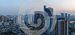 Cityscape of Hanoi skyline in Cau Giay district by Cau Giay park during sunset time in Hanoi city, Vietnam