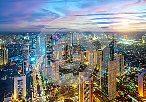 Cityscape of high rise buildings in Jakarta, Indonesia at night