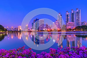 Cityscape image of Benchakitti Park at twilight time in Bangkok, Thailand.