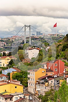 Cityscape of Istanbul, Turkey from Pervititch Seyir Park, including traditional houses and Bosphorus Bridge