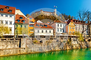 Cityscape of Ljubljana on a sunny day. Colorful historical buildings along the Ljubljanica River, Slovenia