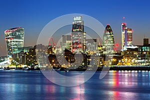 Cityscape of London with reflection in Thames river