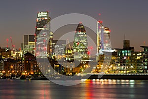 Cityscape of London with reflection in Thames river