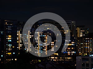 Cityscape of the luxury condominium apartments at Cairnhill Crest, Orchard Road, Singapore in the evening with the windows lighted