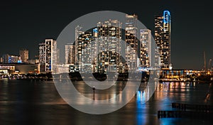 Miami, Florida, USA - March 3, 2022 - Colorful cityscape of Miami's luxurious condos at night.