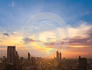 Cityscape of modern buildings and urban architecture. Aerial view of Bangkok city at twilight sunset in Thailand