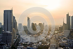 Cityscape of modern buildings and urban architecture. Aerial view of Bangkok city at twilight sunset in Thailand